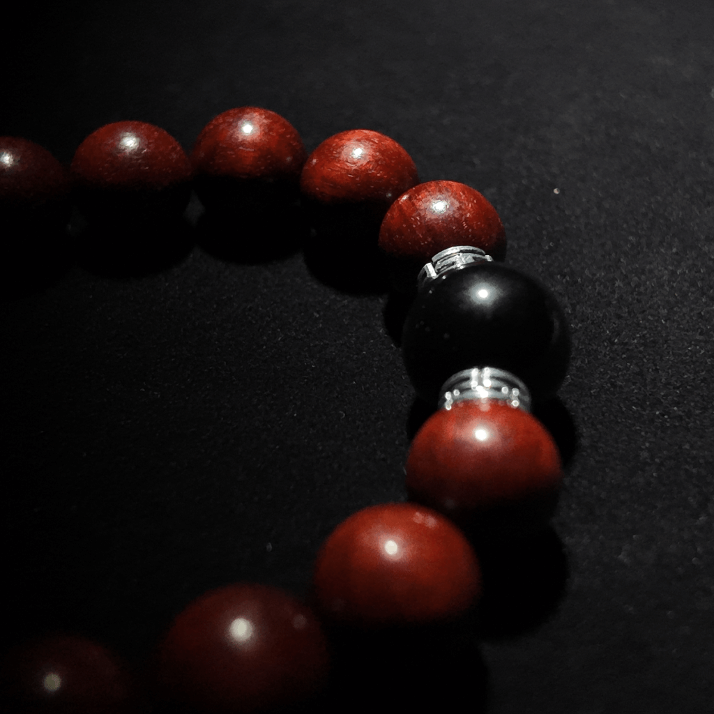 Handcrafted crimson sandalwood and black obsidian bead bracelet