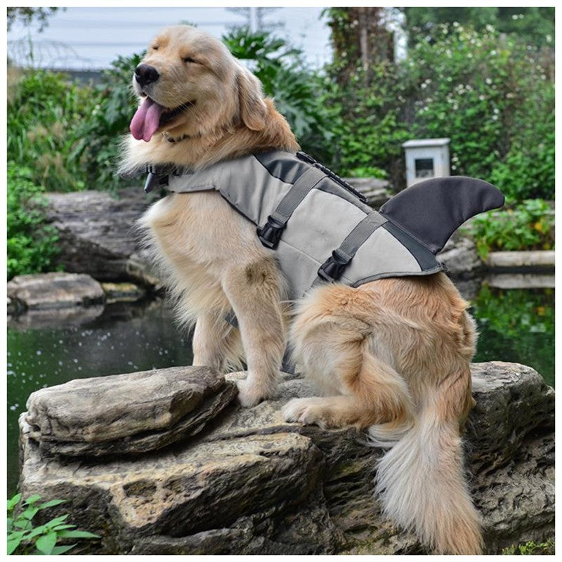 Side full view of orange dog life jacket with reflective panels and PawGear label.