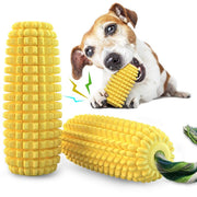 Labrador puppy chewing yellow corn-shaped TPR dog toy