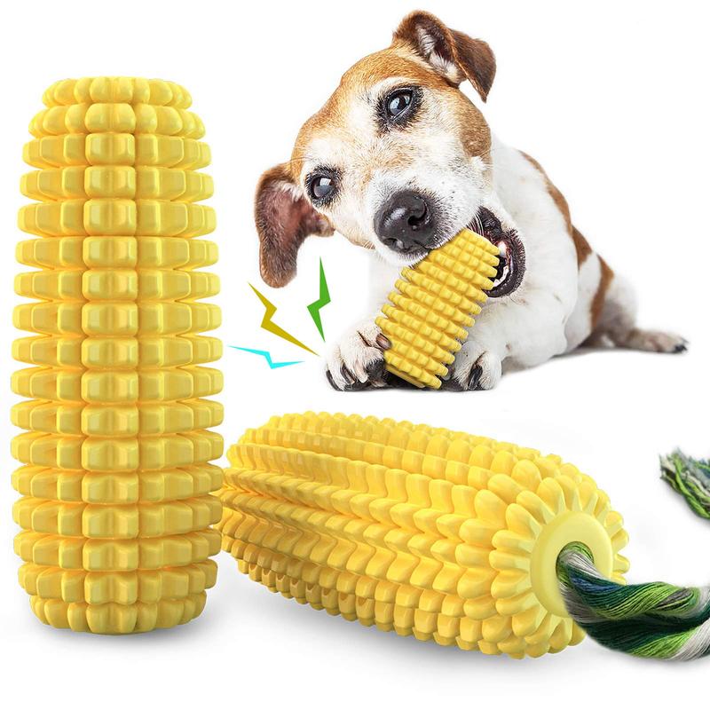 Labrador puppy chewing yellow corn-shaped TPR dog toy
