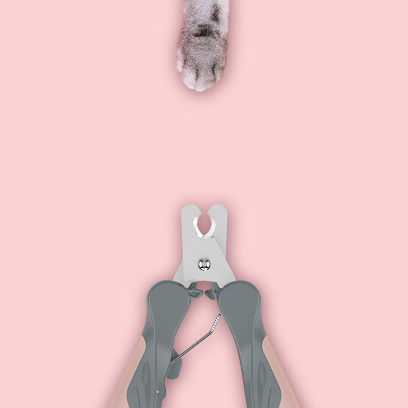 Close-up of the pink pet nail clipper showing the safety lock