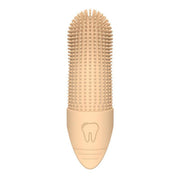 Beige silicone pet finger toothbrush close-up on white background