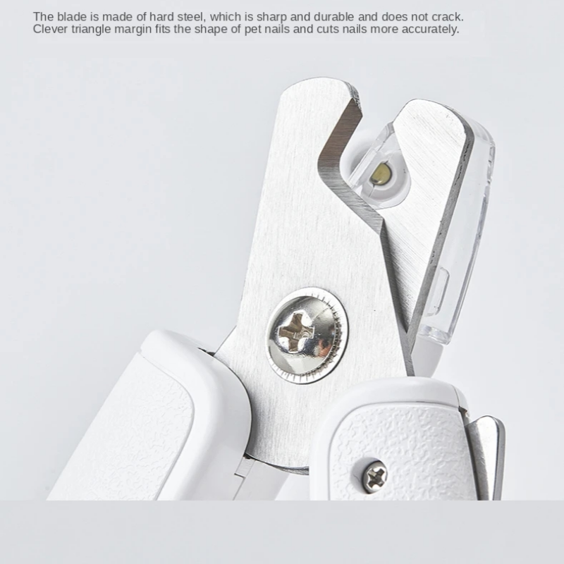 Hand holding white pet nail trimmer with ON/OFF switch and ergonomic grip