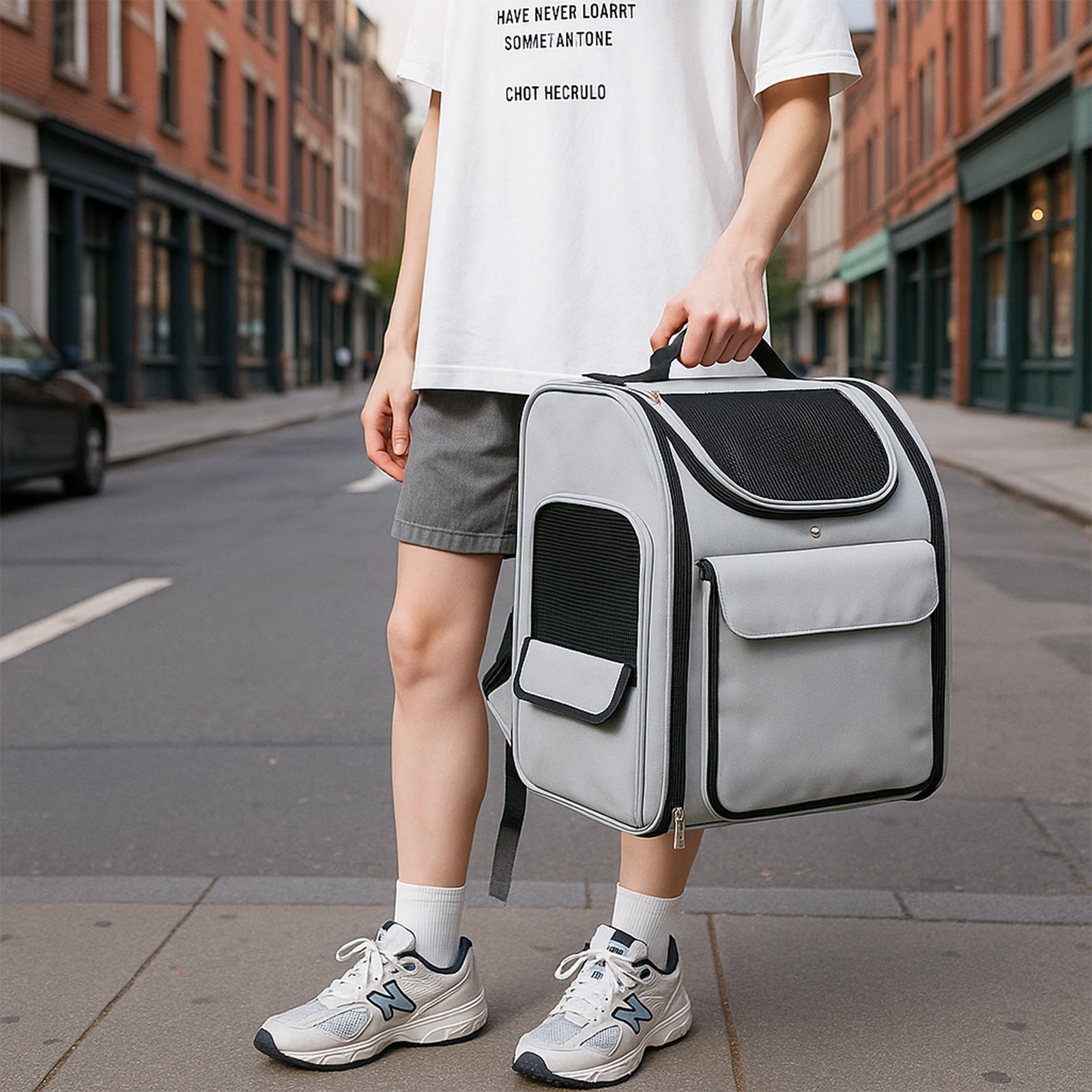 Three-quarter front view with top mesh window and large front pocket.