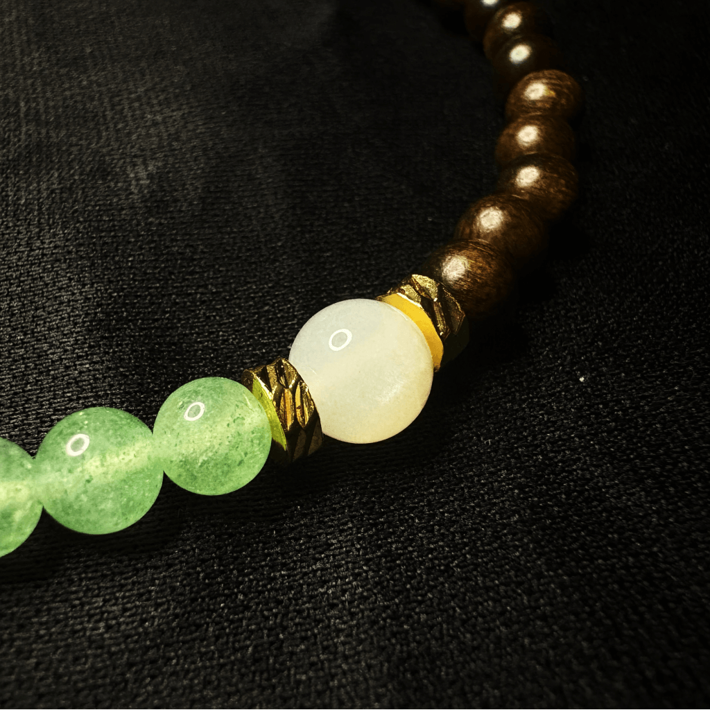 Green strawberry quartz, agarwood, and moonstone bracelet